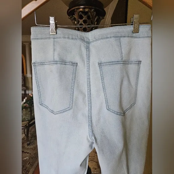 NWOT We The Free light wash boot cut jeans