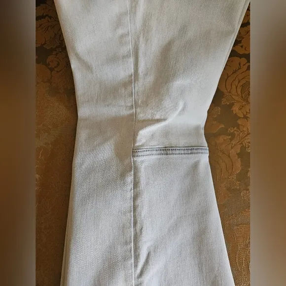 NWOT We The Free light wash boot cut jeans