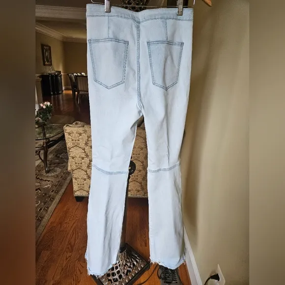 NWOT We The Free light wash boot cut jeans