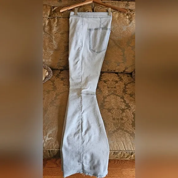 NWOT We The Free light wash boot cut jeans